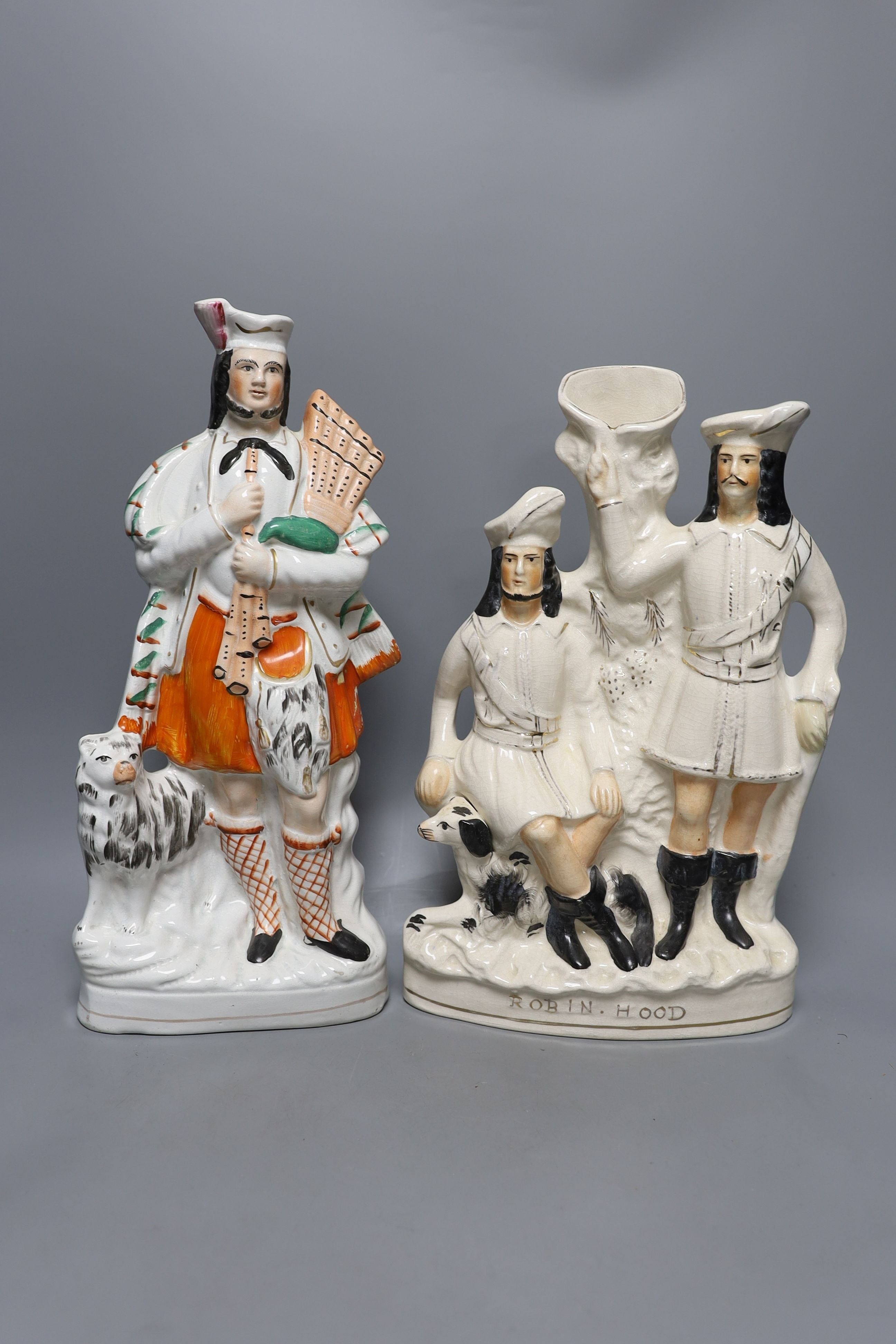 Four 19th century Staffordshire pottery groups - 40cm tall